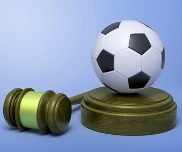 Justice hammer facing a soccer ball