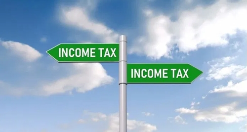 Two signposts: one to the tax centre and the other to tax evasion