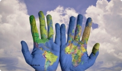 Two open hands with the world drawn on them